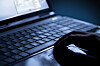 A person uses a laptop. [SHUTTERSTOCK]