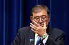 Japanese Prime Minister Shigeru Ishiba adjusts his glasses during a press conference as he announces his resignation, in Tokyo on September 7. [REUTERS/YONHAP]
