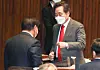 Ruling Democratic Party (DP) Chairman Rep. Lee Nak-yon, right, gives a fist bump to DP floor leader Rep. Kim Tae-nyeon at the National Assembly on Dec. 14 after their party successfully passed a bill criminalizing the distribution of propaganda leaflets to North Korea on the inter-Korean border. [YONHAP]