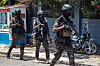 Agents of the Haitian National Police PNH confront bandits around Champs de Mars, the main public square of the city, where intense shots were heard throughout the afternoon, in Port-au-Prince, Haiti, on Monday. [EPA/YONHAP]