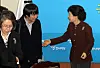 In this file photo, Park Geun-hye, then acting leader of the Grand National Party, right, talks to Lee Jun-seok, a member of the acting leadership, in December 2011.