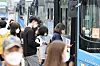 People are seen wearing face masks as they board a bus in Seocho District, southern Seoul, Monday, a day before a new rule goes into effect that allows bus and taxi drivers to refuse passengers without a face covering. [YONHAP]
