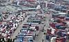Containers for exports and imports are stacked at a pier in Busan on May 22. [YONHAP]