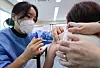 Medical personnel at a long-term care facility in Yangcheon District, western Seoul, administer the AstraZeneca vaccine to employees under the age of 65. [YONHAP]