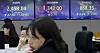 Screens in Hana Bank's trading room in central Seoul show stock and foreign exchange markets open on Thursday. [NEWS1]