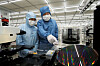 Doosan Chairman Park Jeong-won checks a wafer testing facility at Doosan Tesna's factory in Anseong, Gyeonggi. [DOOSAN]
