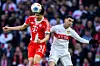Bayern Munich’s Kim Min-jae, left, battles for the ball with Stuttgart’s Bilal El Khannous during a Bundesliga match at MHP Arena in Stuttgart, Germany, on Dec. 6. [AP/YONHAP]
