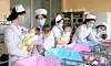 Nurses take care of three girls and two boys born to mother Pak Kyong-sim and her husband, Son Chung-hyo, at a maternity clinic in Pyongyang, in this undated photo released by North Korea's official Korean Central News Agency on June 20. [YONHAP]