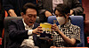 President Yoon Suk Yeol, left, and first lady Kim Keon-hee share a bucket of popcorn at a screening of the movie ″Broker″ at a Megabox movie theater in Seongsu District, eastern Seoul, on May 12, 2022. [NEWS1]