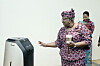 Ngozi Okonjo-Iweala, director-general of the World Trade Organization (WTO), inspects the Rookie delivery robot at the Naver 1784 building in Seongnam, Gyeonggi, on Tuesday. Okonjo-Iweala visited the Naver 1784 building during her three-day trip to Korea which began on Monday. It is the first time in 10 years that a WTO chief has visited Korea. [NAVER]
