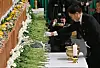 National Assembly Speaker Woo Won-shik on Monday places wreaths at a memorial altar set up in Muan Sports Complex in Muan, South Jeolla, for bereaved families of the victims of Sunday’s Jeju Air crash. [JOONGANG ILBO]