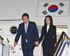 President Yoon Suk-yeol, left, and first lady Kim Keon-hee disembark from the presidential jet at Seoul Air Base in Seongnam, Gyeonggi, early Wednesday after concluding a six-day trip to Cambodia and Indonesia. [YONHAP]
