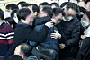 Bereaved families of the victims of Sunday’s Jeju Air crash hold each other and grieve at Muan International Airport in Muan, South Jeolla, on Monday. [JOINT PRESS CORPS]