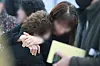 Bereaved families of the victims of Sunday’s Jeju Air crash grieve at Muan International Airport in Muan, South Jeolla, on Monday. [JOINT PRESS CORPS]