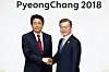 In this file photo, President Moon Jae-in, right, and Japanese Prime Minister Shinzo Abe stand for a photo before their summit in Yongpyeong, Gangwon Province, on the sidelines of PyeongChang Winter Olympic Games in 2018. [Presidential Press Corps]