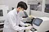 A Samsung Electronics researcher look at a sample in the company's Eco-Life Lab in Suwon, Gyeonggi. [SAMSUNG ELECTRONICS]