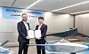 Im Jin-kyu, right, head of aerospace business division at Korean Air and Brian Schimpf, co-founder and chief executive officer of Anduril Industries pose for a photo in Seoul on April 2, 2025, in this photo provided by Korean Air. [YONHAP]