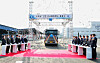 Dangjin Mayor Kim Hong-jang (fifth from left) and other participants press a button to celebrate the completed construction of the HyNet Dangjin Hydrogen Shipment Center, located within Hyundai Steel’s Dangjin factory in South Chungcheong. [YONHAP]