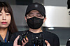 Jeon Cheong-jo speaks to reporters in front of Songpa Police Station in eastern Seoul before she is transferred to the prosecution on Friday. [NEWS1]