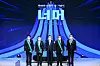 President Moon Jae-in, center, stands with the recipients of awards for advancing industries at the Korea Chamber of Commerce and Industry in central Seoul on Wednesday.[YONHAP]
