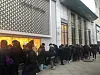 People lined up outside a department store waiting for a sale to begin. [LOTTE SHOPPING]