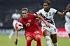 Canada's Christine Sinclair competes for the ball with Trinidad and Tobago's Victoria Swift during a Concacaf women's championship match in Monterrey, Mexico on July 5, 2022. [AP/YONHAP]