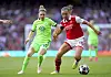 Arsenal's Katie McCabe, right, battles for the ball during a Women's Champions League semifinal match against VfL Wolfsburg at the Emirates Stadium in London on May 1. [AP/YONHAP]