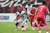 Haiti's Melchie Dumornay, left, fights for the ball with Korea's Ji So-yun during a friendly at Seoul World Cup Stadium in central Seoul on July 8. [AP/YONHAP]