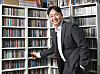 Pop culture critic Jung Min-jae poses at his home office. [PARK SANG-MOON]