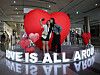 Foreign visitors take a photo of themselves in front of a heart-shaped art structure themed 'Love is all around you' at Coex in southern Seoul on Wednesday. [YONHAP]