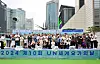 Participants and dignitaries pose for a photo during an event celebrating the 10th International Day of Yoga at COEX Plaza in Gangnam District, southern Seoul, on Saturday. [EMBASSY OF INDIA]