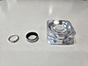 From left, a ring from a jewelry brand, the Galaxy Ring in silver shade, and its charger [JIN EUN-SOO]