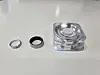 From left, a ring from a jewelry brand, the Galaxy Ring in silver shade, and its charger [JIN EUN-SOO]