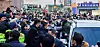 Cho Doo-soon, convicted of raping an eight-year-old girl in 2008, emerges from a car amid a crowd of protestors and media to return home after being released from prison following a 12-year sentence on Saturday. [NEWS1]