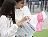 Attendees look through pamphlets at a job fair for international students in Busan, held in July. [NEWS1]