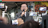 Democratic Party leader Lee Jae-myung delivers a speech at a traditional market in Andong, North Gyeongsang on Thursday, a day after prosecutors issued him a summons for questioning over bribery allegations involving Seongnam's football club. [YONHAP]