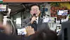 Democratic Party leader Lee Jae-myung delivers a speech at a traditional market in Andong, North Gyeongsang on Thursday, a day after prosecutors issued him a summons for questioning over bribery allegations involving Seongnam's football club. [YONHAP]
