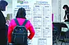 A woman seeking a job is checking information on job openings at a job fair in Dong District, Daegu, in November 2020. [NEWS1]