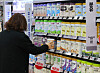 A shopper looks at milk powder products in a store in downtown Seoul on Feb. 18. [YONHAP]