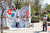 People pose in front of a cardboard box drawing depicting a scene in Switzerland at the Gyeongui Line Book Street in Mapo District, western Seoul, on Sunday. This year marks the 60th anniversary of diplomatic relations between Korea and Switzerland. [YONHAP]