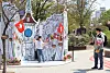 People pose in front of a cardboard box drawing depicting a scene in Switzerland at the Gyeongui Line Book Street in Mapo District, western Seoul, on Sunday. This year marks the 60th anniversary of diplomatic relations between Korea and Switzerland. [YONHAP]