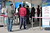 People stand in line to get tested for Covid-19 at a testing center near Seoul Station on Sunday. [YONHAP]