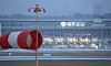 Heavy snow falls and strong winds blow at Jeju International Airport on Tuesday. [YONHAP]