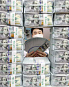 An employee poses with stacks of dollar bills at a Hana Bank branch in Jung District, central Seoul, on Thursday. According to data from the Bank of Korea (BOK), foreign exchange reserves came to $418.95 billion as of the end of August, up $2.4 billion from a month earlier. Korea's foreign exchange reserves have been increasing for five consecutive months. [YONHAP]