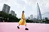 A model, wearing a clothing line from Bmuet(te), walks down the 250-meter (820-feet) runway of 'Seoul Fashion Road' at the western side of Seokchon Lake in Songpa District, southern Seoul, last Friday. [SEOUL METROPOLITAN GOVERNMENT]