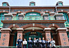 Choi Eung-chon, head of the Cultural Heritage Administration, fourth from left, and other dignitaries celebrate the hanging of a replica signboard of the newly reconstructed Dondeokjeon at Deoksu Palace in Seoul on Monday. Dondeokjeon is a Western-style building where Emperor Sunjong of the Korean Empire was held after Emperor Gojong was forced to abdicate by Japan in 1907. Sunjong used the building to meet with foreign envoys. The reconstruction of Dondeokjeon, which started in 2017, was completed in November last year and is now being prepared to be opened to the public in September. [YONHAP]