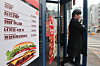 A menu pamplet is posted at a Burger King store in Seoul on Wednesday. Burger King will raise prices for some of its menu items from Friday, announced the global burger company on Wednesday. The prices of 32 burgers, 15 snacks and drinks will be upped by 2 percent on average. Its trademark Whopper will be sold at 7,100 ($5.40) won from Friday, up 200 won. [YONHAP]