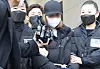 The 3-year-old girl's biological mother, a 48-year-old woman, entering a court in Daegu on March 17 for the hearing on her arrest warrant. [NEWS1]
