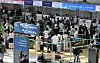 Travelers wait in line at airline counters at Incheon International Airport. [YONHAP]