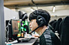 Mid laner Kwak ″Bdd″ Bo-seong stares intently at his monitor in the Gen.G training facility. [GEN.G]